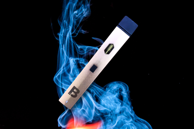blinker vape on dark background with smoke